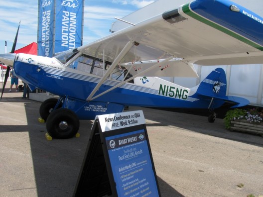 Aviat A1-C CNG outside AeroVenture Innovation Pavilion, the placard extolling its many virtues