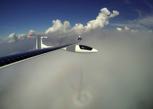 Basking in its own glory, the Duo frames itself over a cloud bearing its shadow and a faint rainbow
