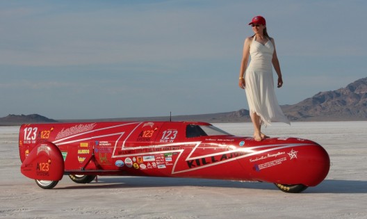 A red dress for 240 mph, a white dress for 270.  What color will she wear for 300?