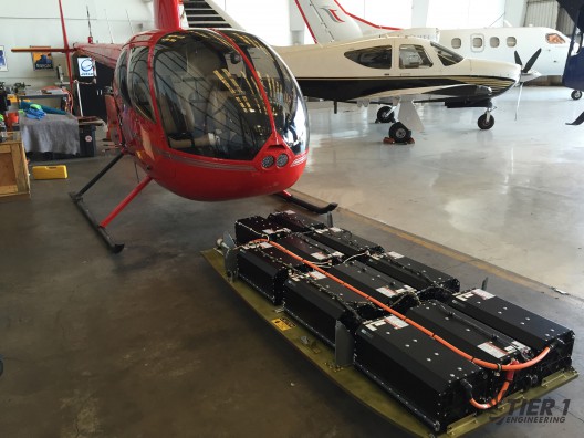 Mounted under R44, 1,100 pound battery pack meets 2,500 pound gross weight goal